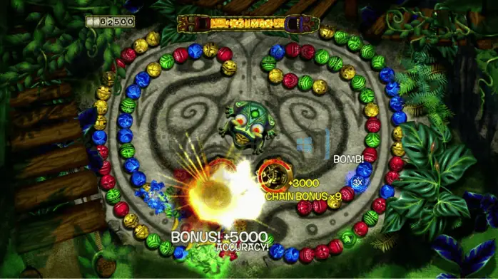 لقطة شاشة للعبة زوما على الكمبيوتر الشخصي، تتميز بالكرات الملونة وخلفية الغابة النابضة بالحياة.