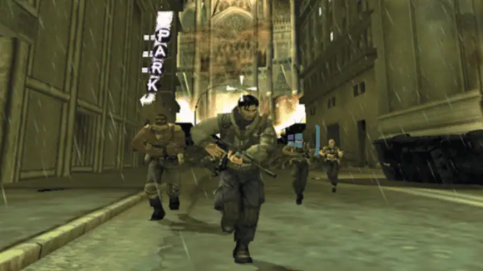 لقطة شاشة تحميل لعبة Freedom Fighters" على الكمبيوتر الشخصي، تُظهر شخصيات في مشهد قتال حضري تكتيكي.