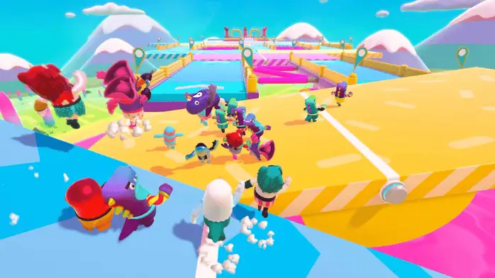 شخصيات ملونة في لعبة Fall Guys، تعرض مسارات العقبات الممتعة والحركة متعددة اللاعبين على الكمبيوتر الشخصي.